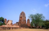 Wat Phra Mahathat was built during the reign of Borommaracha I (Boromma Rachathirat I) or Khun Luang Pa Ngua (1370- 1388), who was the third king of the Ayutthaya Kingdom.<br/><br/>

Ayutthaya (Ayudhya)) was a Siamese kingdom that existed from 1351 to 1767. Ayutthaya was friendly towards foreign traders, including the Chinese, Vietnamese (Annamese), Indians, Japanese and Persians, and later the Portuguese, Spanish, Dutch and French, permitting them to set up villages outside the city walls. In the sixteenth century, it was described by foreign traders as one of the biggest and wealthiest cities in the East. The court of King Narai (1656–1688) had strong links with that of King Louis XIV of France, whose ambassadors compared the city in size and wealth to Paris.
